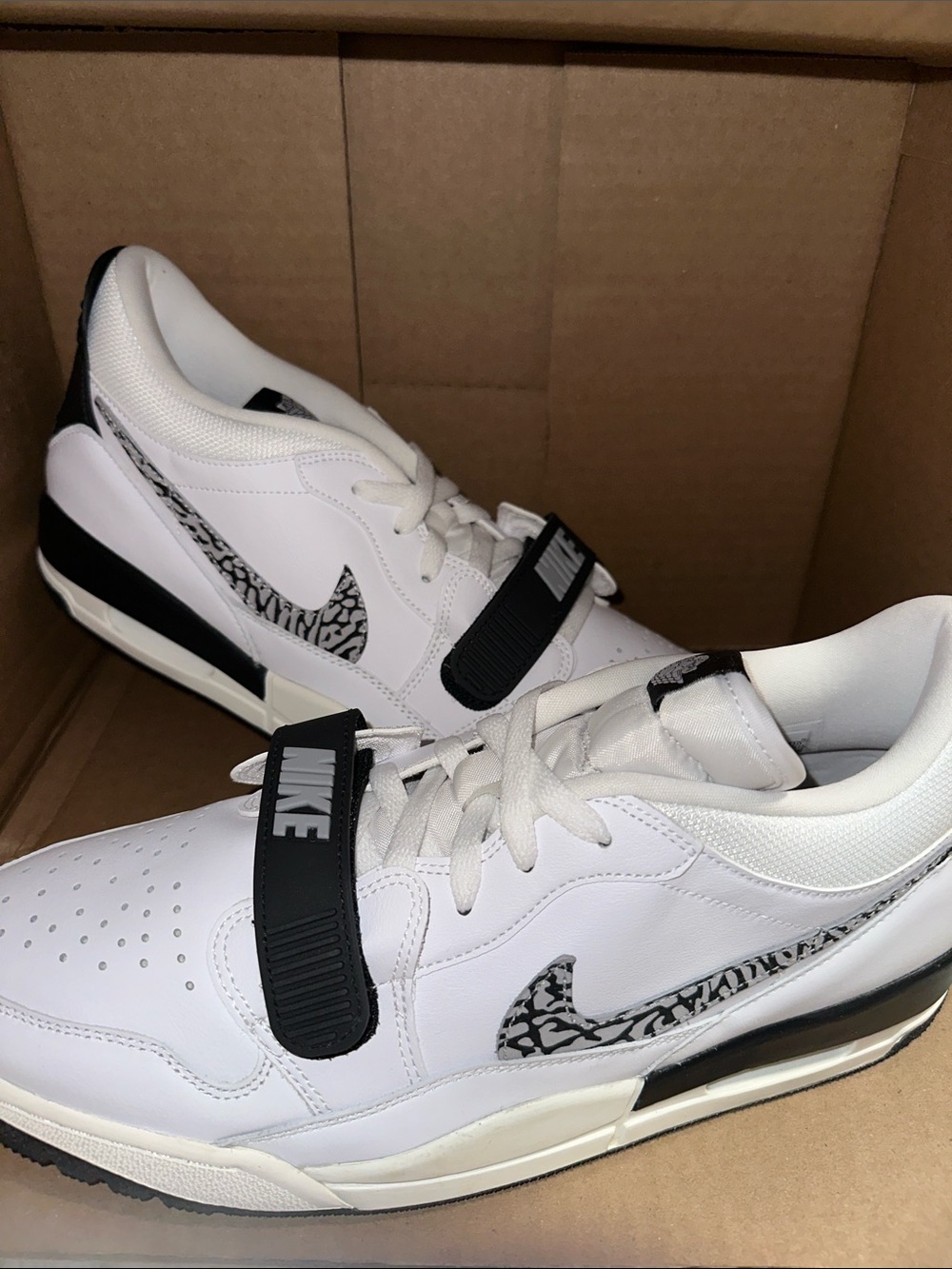 Nike Jordan Men’s White and Black Low-Top Sneakers with Patterned Swoosh